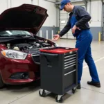 Mechanic Using Rolling Tool Cart While Repairing a Car