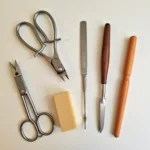 A comprehensive set of nail care tools, including clippers, files, cuticle pushers, and buffers, each holding a unique significance within the practice of nail care.