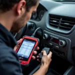 Mechanic Using an OTC Diagnostic Scan Tool to Diagnose Car Problems