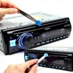 Sony car stereo removal U-shaped tools in action