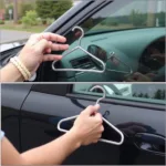 Attempting to unlock a car door with a coat hanger