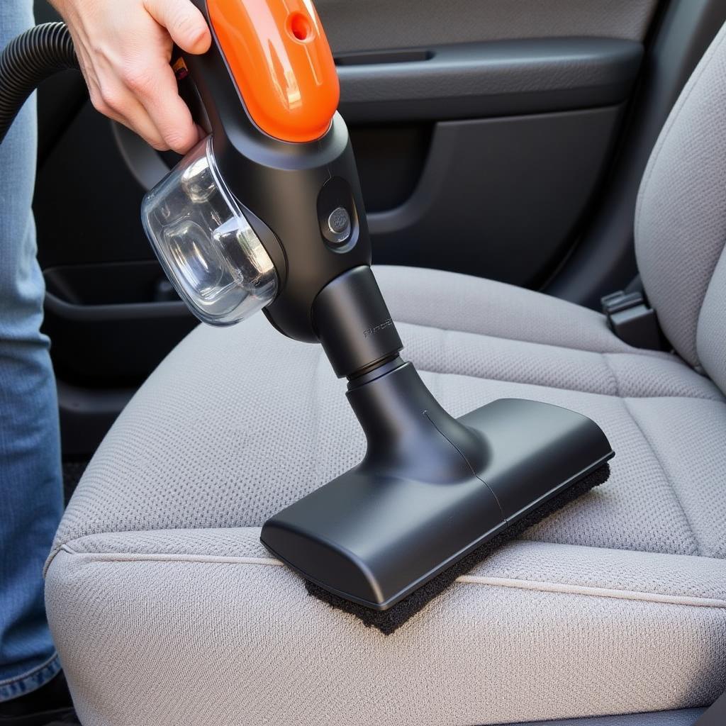 Vacuuming Car Upholstery with Attachment