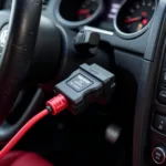 A VAG-COM cable connected to a car's OBD-II port.