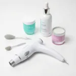 A collection of different blackhead removal tools, including a blackhead vacuum suction tool, extraction tools, and skincare products.