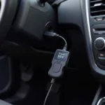 Bluetooth scan tool plugged into a car's OBD-II port