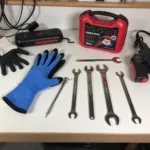 Car Battery Tool Kit Essentials: Gloves, Wrenches, Terminal Cleaner, Puller, and Jump Starter