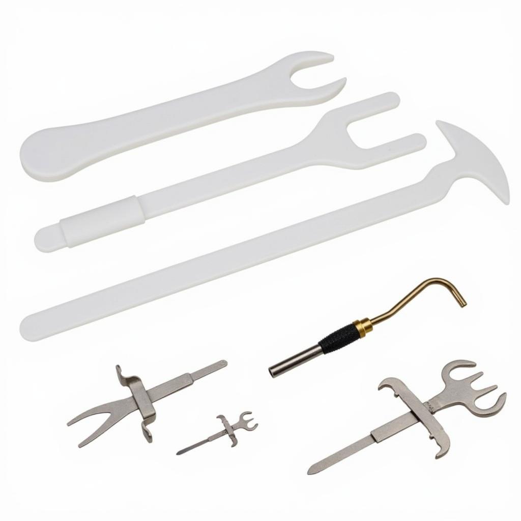 An assortment of different types of car door panel removal tools, showcasing their various shapes and uses.