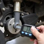 Digital Car Wheel Alignment Tool in Use