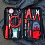 Essential Car Breakdown Toolkit Laid Out on a Tarp