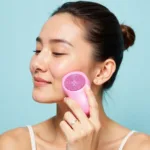 Woman using a facial cleansing brush