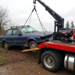 Hydraulic winch recovering a heavily damaged salvage car