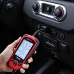 KW808 Car Scanner Tool Connected to OBD2 Port