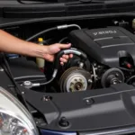 Mechanic Using On-Car Bubble Flare Tool in Tight Engine Bay