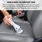 Person using a crevice tool to clean car seats