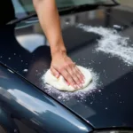 Applying Rubbing Compound to Car Paint