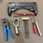 Specialized Car Dismantling Tools: Panel Removal Tools, Battery Terminal Puller, and Spring Compressor