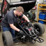 Mechanic Adjusting Sprint Car Weight