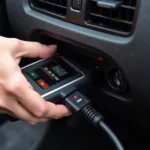 Connecting a universal car fault reader code scanner diagnostic tool to a car's OBD-II port