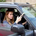 Using an Emergency Windshield Removal Tool to Escape a Car